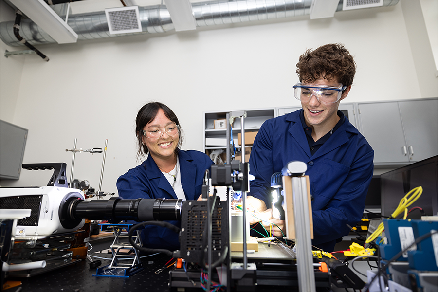 mechanical engineering students working in lab